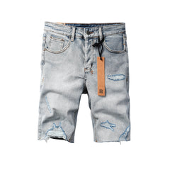 Men's Vintage Light Wash Ripped Denim Shorts with Raw Cut Hem and Distressed Details 2003