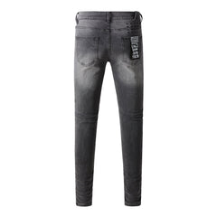 Urban Gray Ripped Jeans with Bold Black Graffiti Accents 3003