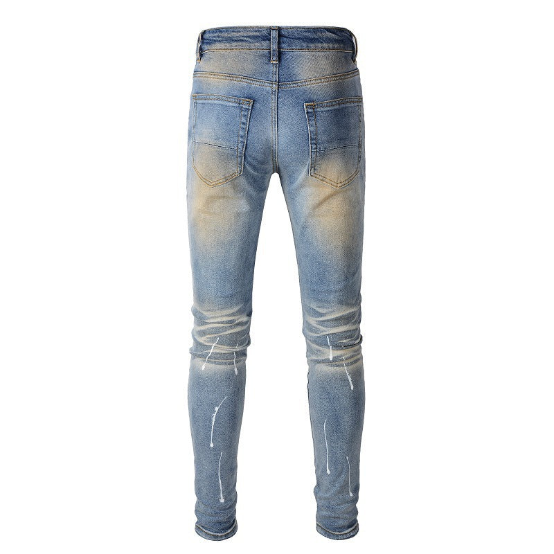 Men's Blue Jeans with Black Patches, Distressed Paint, and Ripped Details (523-6523)